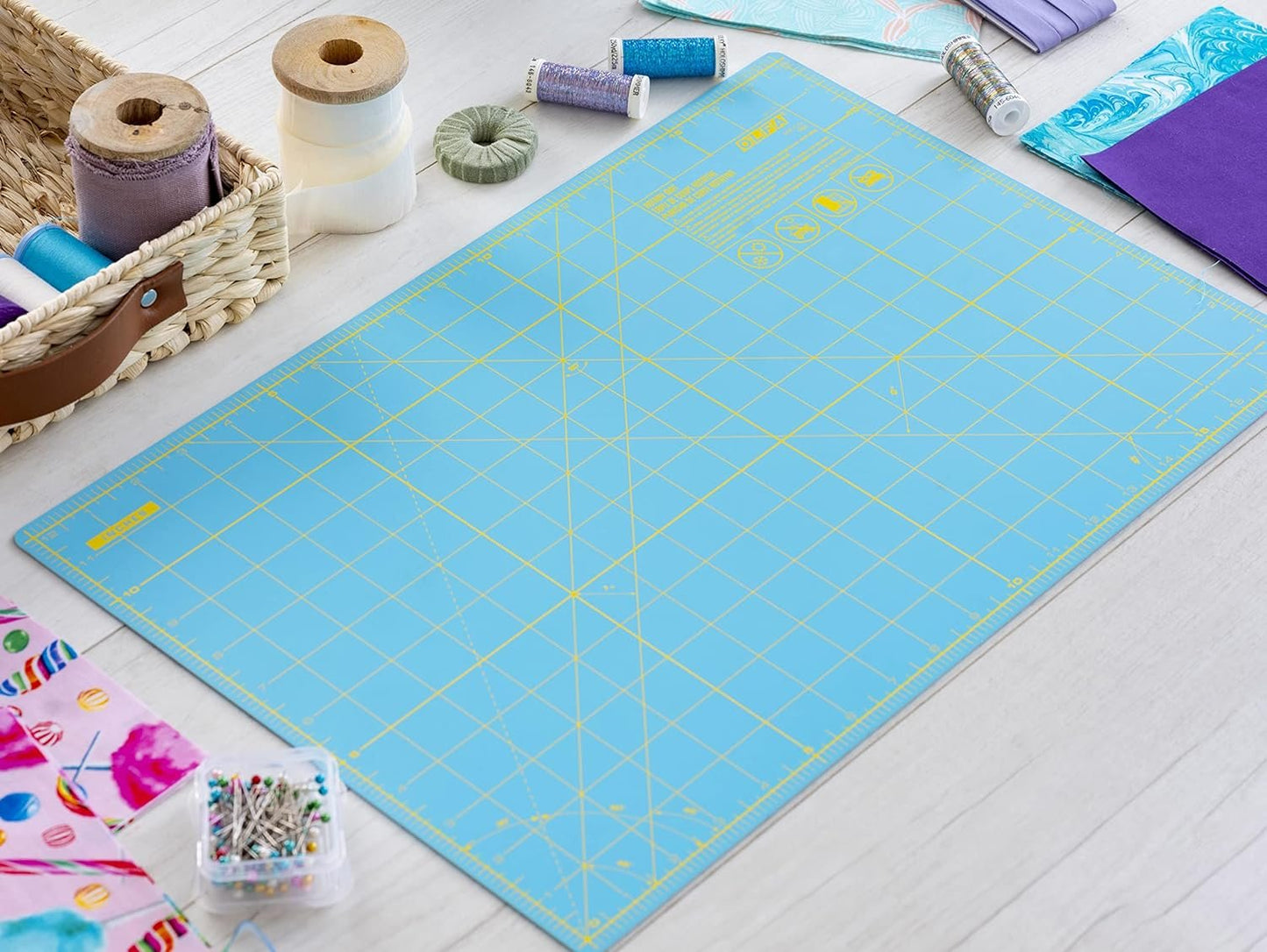 OLFA 12" x 18" Self Healing Rotary Cutting Mat (RM-CG/AQA) - Double Sided 12x18 Inch Cutting Mat with Grid for Fabric, Sewing, Quilting, & Crafts, Designed for Use with Rotary Cutters (Aqua)