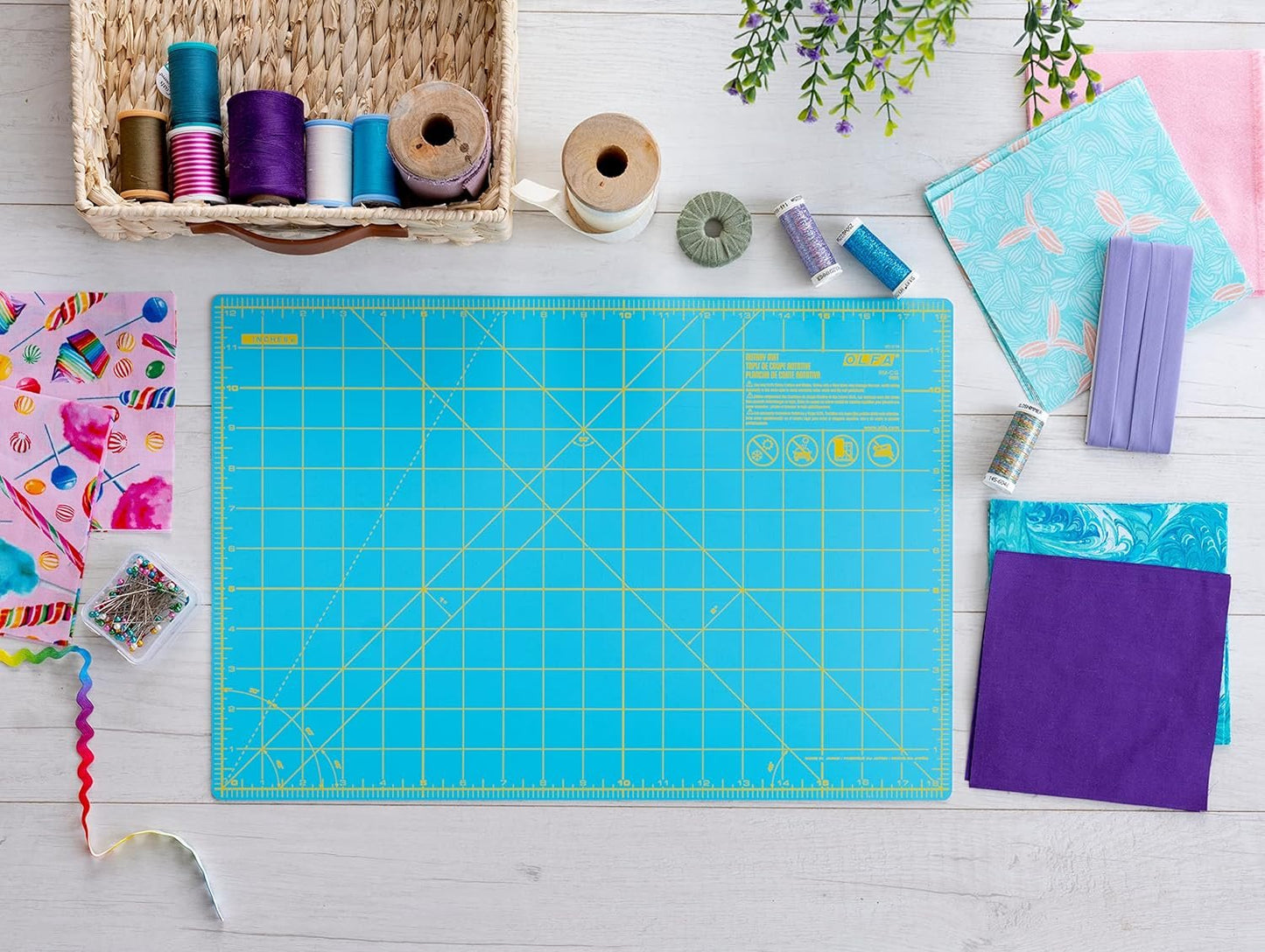 OLFA 12" x 18" Self Healing Rotary Cutting Mat (RM-CG/AQA) - Double Sided 12x18 Inch Cutting Mat with Grid for Fabric, Sewing, Quilting, & Crafts, Designed for Use with Rotary Cutters (Aqua)